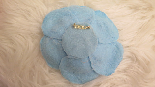 back of blue felt brooch