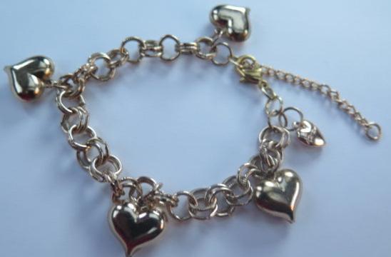 Gold Bracelet with Heart shape charms