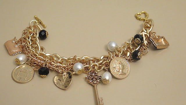 Gold charm statement bracelet