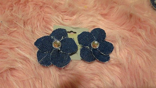 A pair of denim flower earrings.