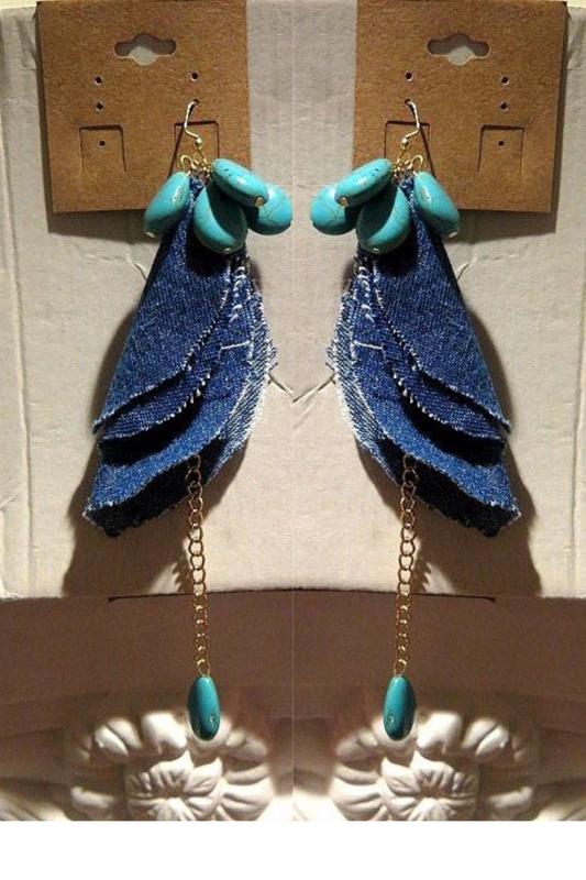 A pair of denim earrings with turquoise beads.