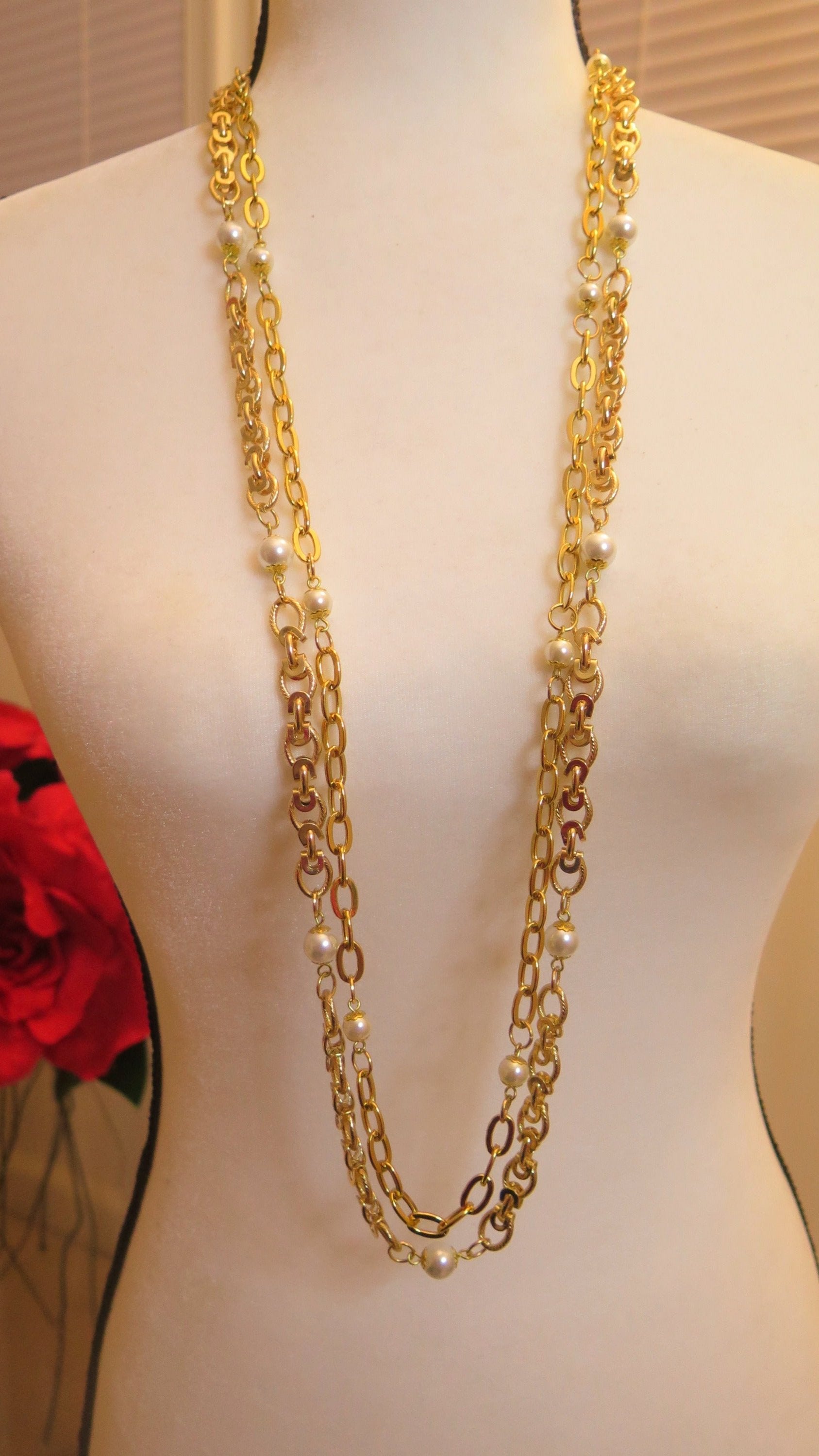 Double long gold necklace with pearl