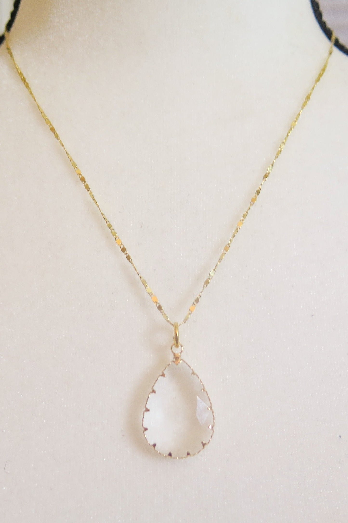 Gold necklace, clear pendant