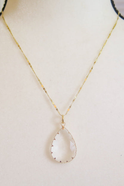 Gold necklace, clear pendant