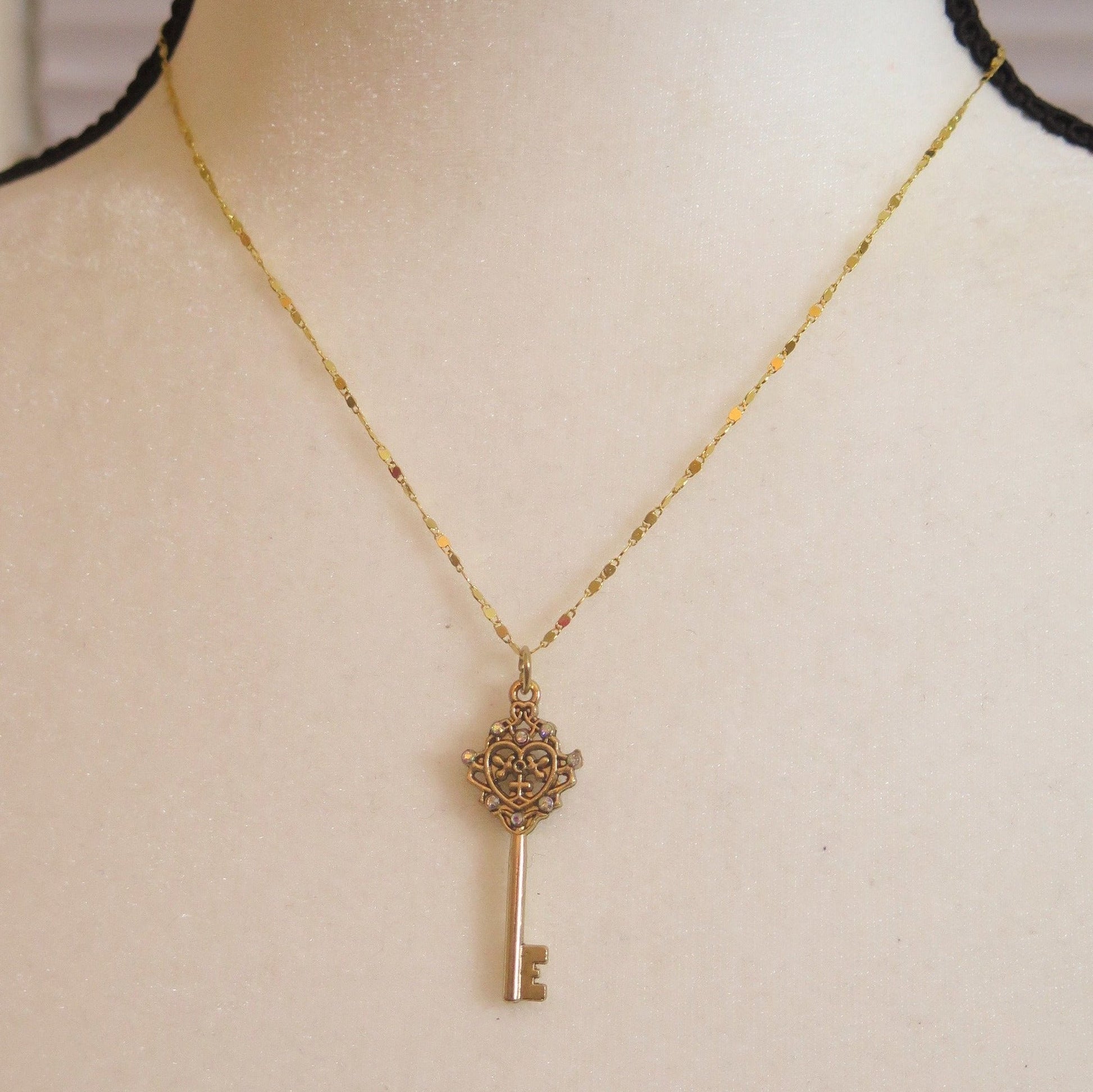 Gold necklace with key pendant