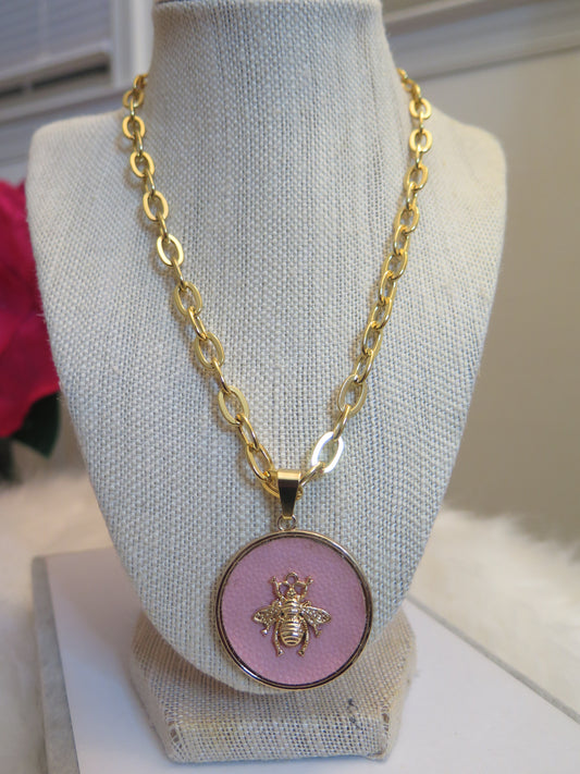 Gold necklace with pink pendant