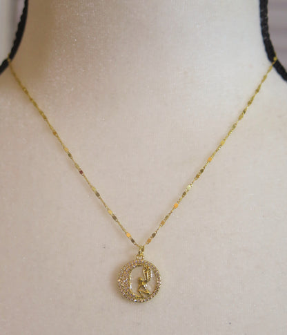 Gold necklace with sparkling pendant