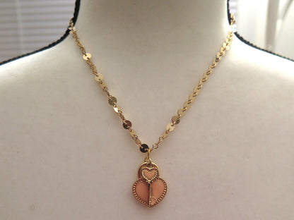 gold necklace with keyheart pendant