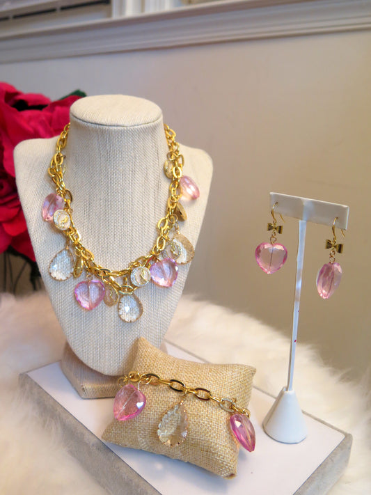 gold necklace with pink heart shape beads vharms