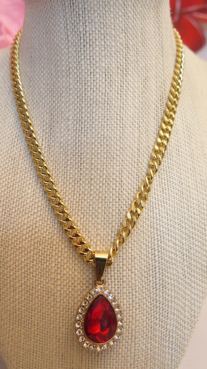 Gold necklace with red pendant