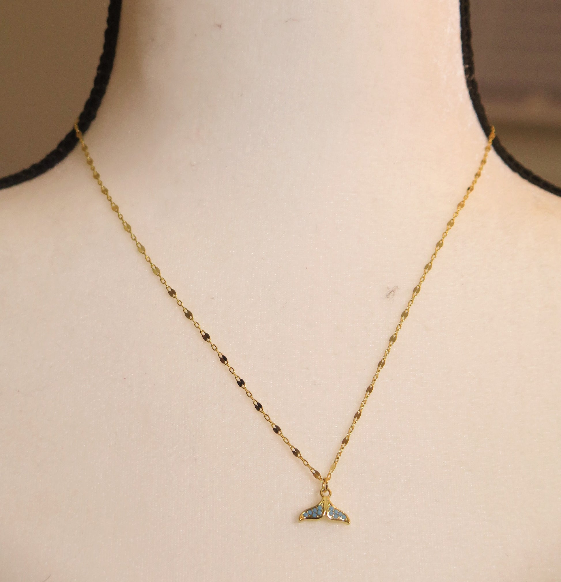 Gold necklace with whole pendant