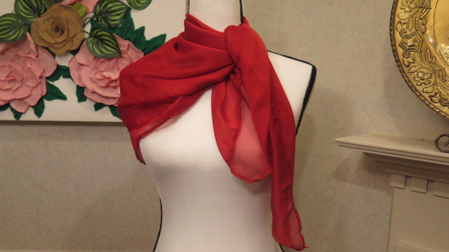 Red scarf worn and styled for women