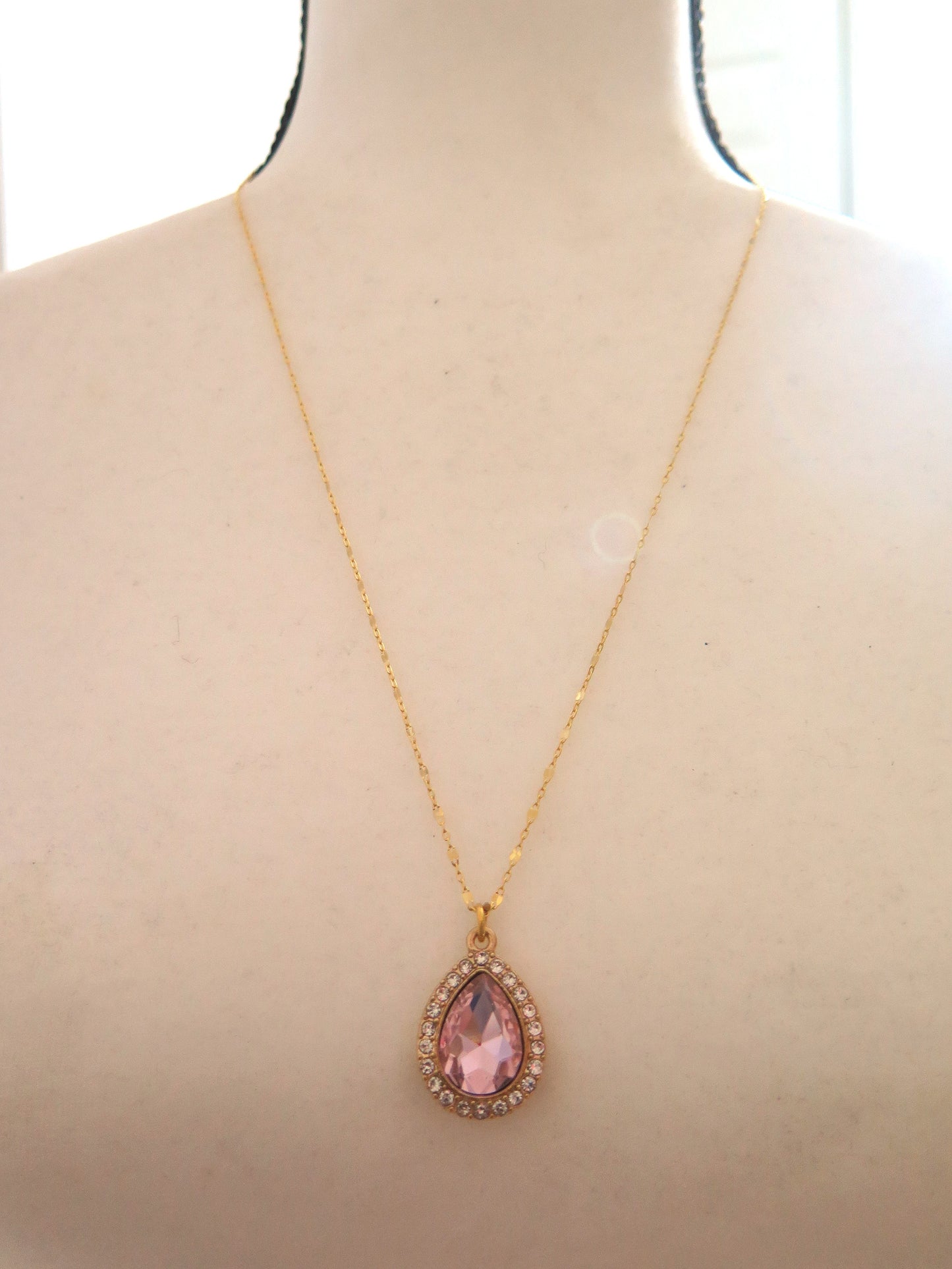 long gold necklace with pink pendant for women