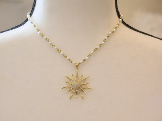 Pearl necklace wth sunburst pendant