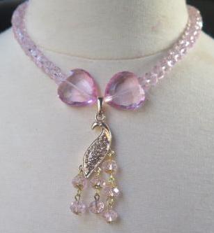 Pink necklace with sparkling peacock pendant for women
