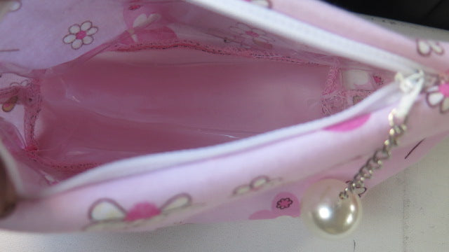 Pink floral toiletry bag open view