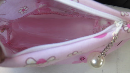 Pink floral toiletry bag open view