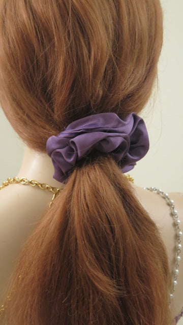 Purple scrunchie on hair