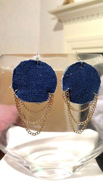A pair of round denim earrings with a chain design