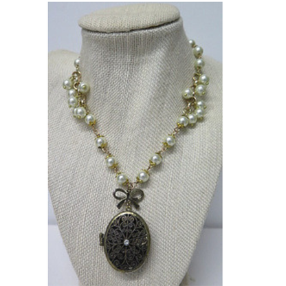 Vintage Style Pearl Necklace with Antique Bronze Filigree Locket | Long Pearl Chain with Bow Charm Oval Photo Locket | 33 Inch Romantic Heirloom Necklace for Women