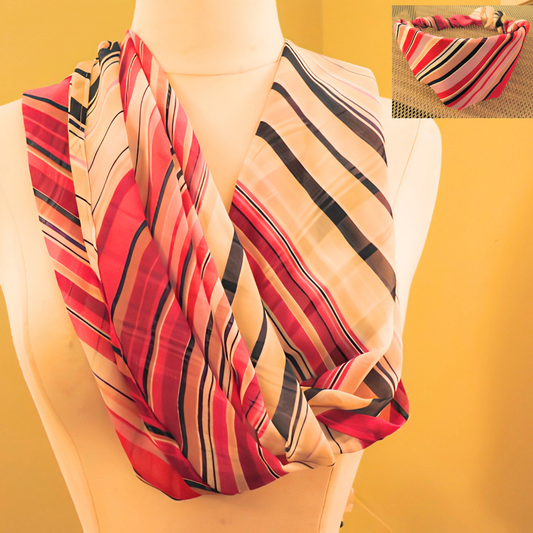 Striped scarf draped over a mannequin with a yellow background