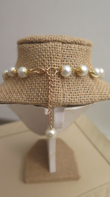 Pearl necklace with rhinestone pendant close up detail