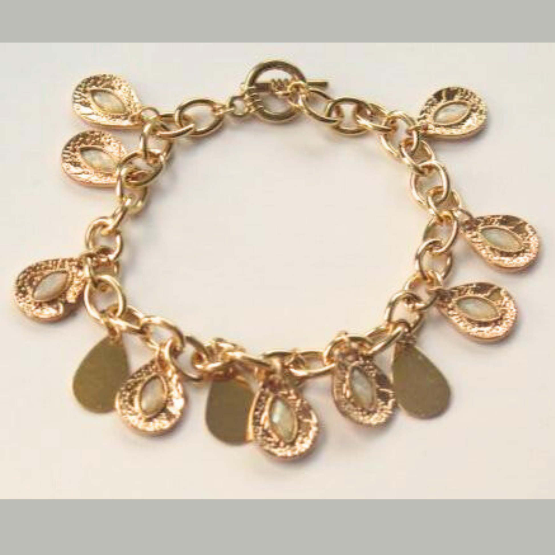 Gold multi charm statement bracelet for women