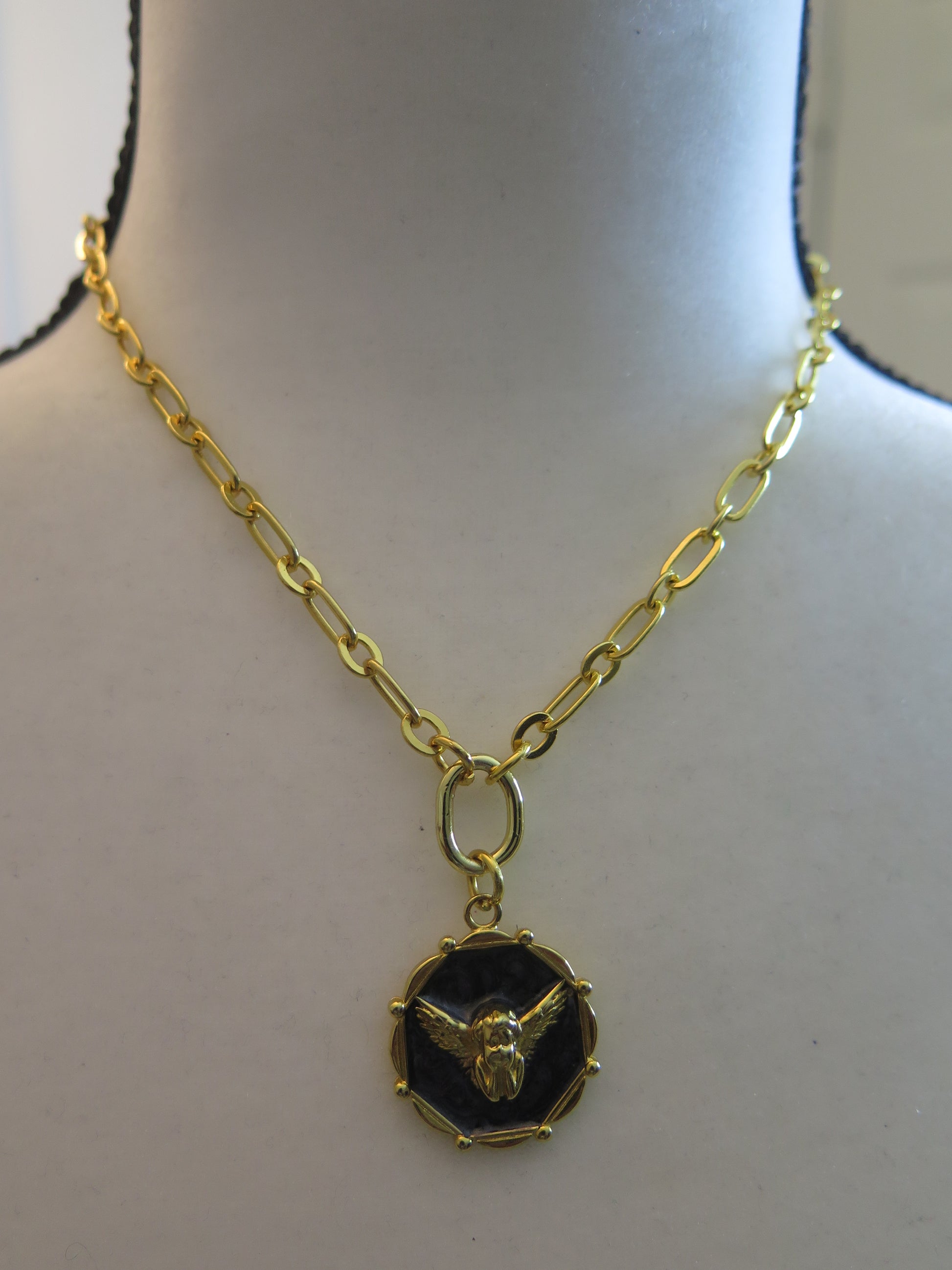 Gold necklace with black pendant