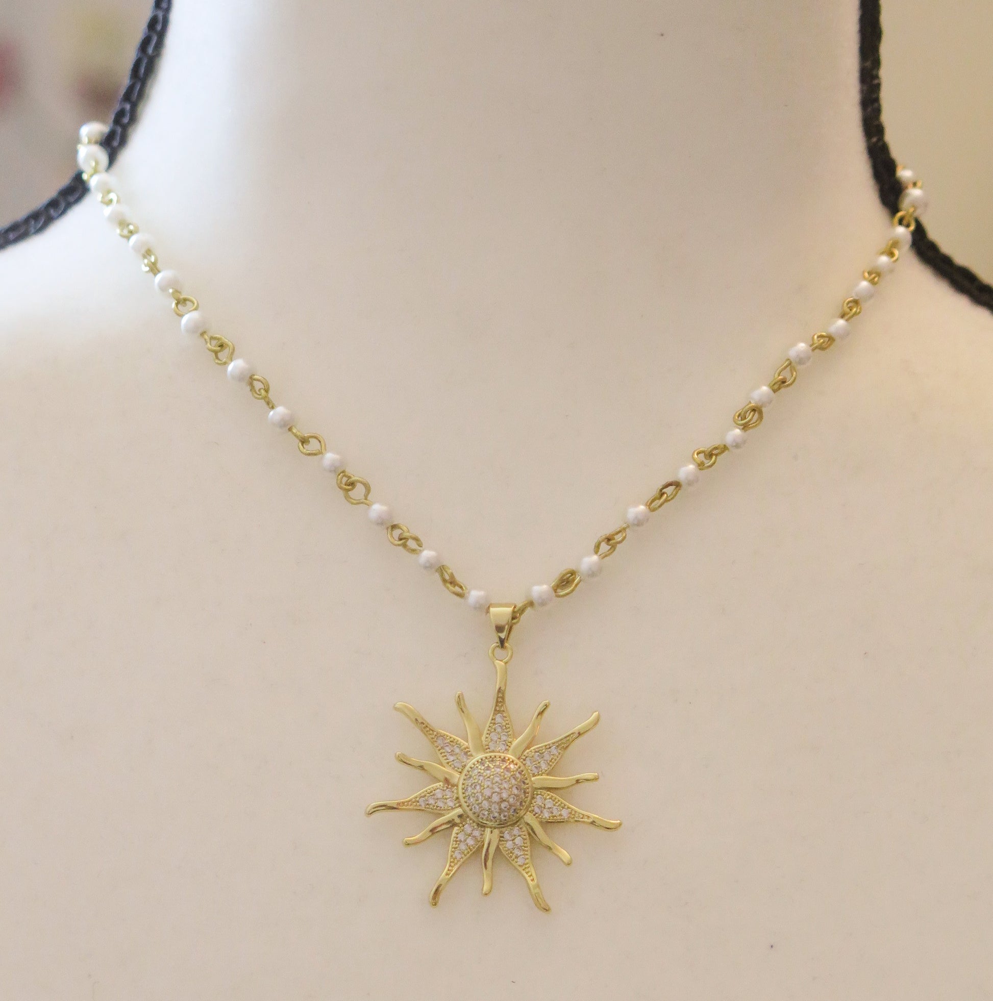 Pearl necklace with gold sunburst pendant for women