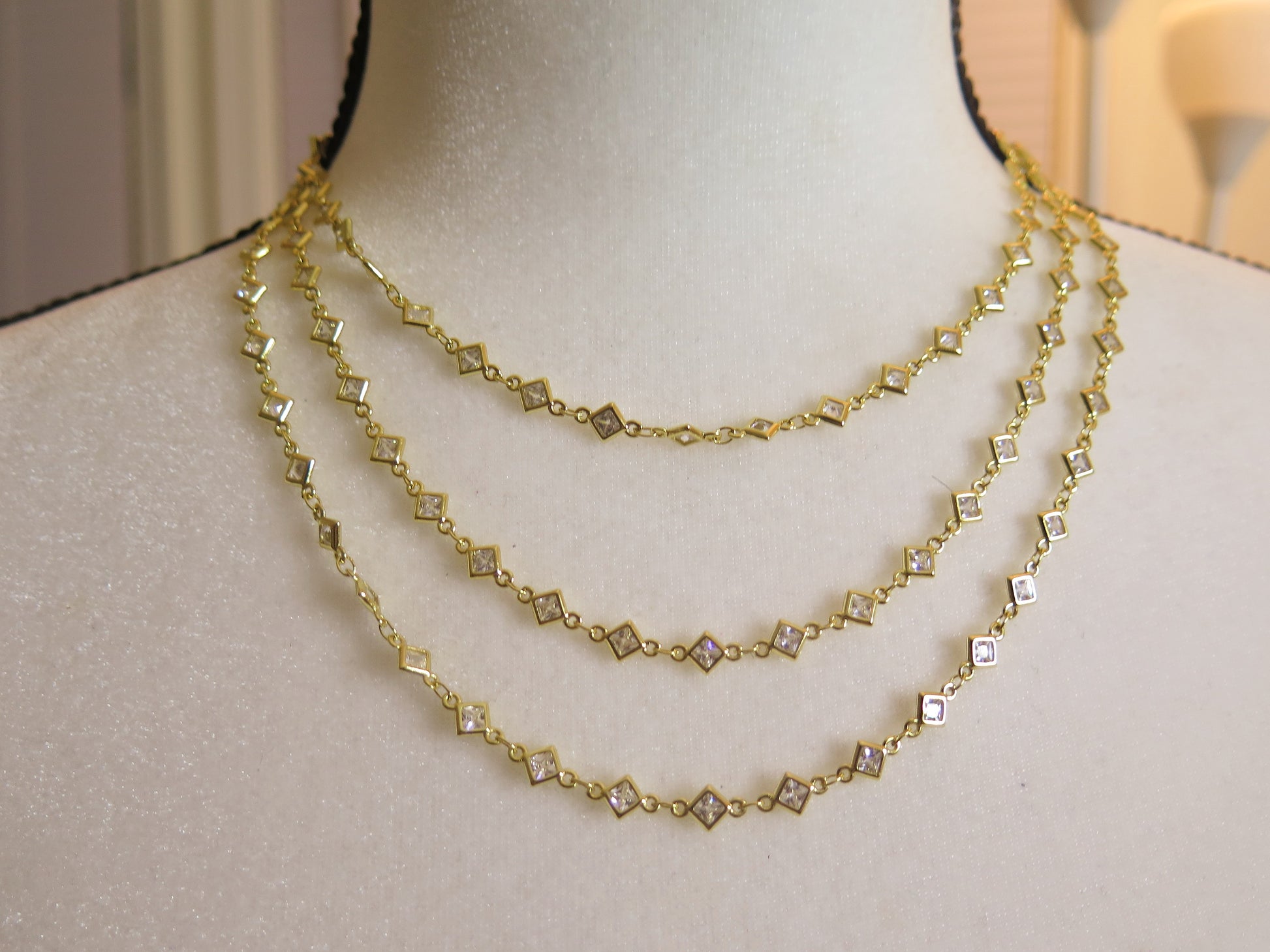 tri gold necklace with sparkling